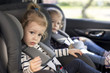 © ondrooo - cute small twins in car seats in the car