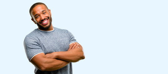African american man with beard confident and happy with a big natural smile laughing, natural expression isolated over blue background