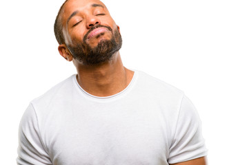 Canvas Print - African american man with beard with sleepy expression, being overworked and tired isolated over white background