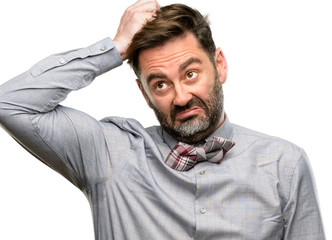 Poster - Middle age man, with beard and bow tie doubt expression, confuse and wonder concept, uncertain future isolated over white background