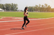 © i am way - Asian woman sport runner in track stadium