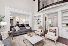Beautiful Living Room Interior With Hardwood Floors, View Of Kitchen And Dining Room In New Luxury Home
