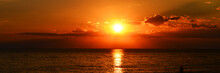 Panorama Of Beutiful Orange Sunset On The Calm Sea
