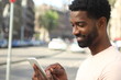 © Djomas - Beautiful man outside with a phone