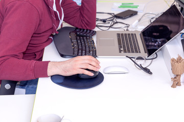 software developer, coder or programmer working on computer