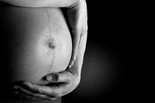 Pregnant Woman Holding Her Tummy
