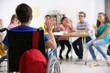 © Africa Studio - Boy in wheelchair with classmates at school