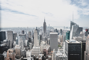 view from rockefeller center plattform over big apple new york city at a light cloudy day with blue 