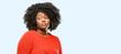 Beautiful african woman having skeptical and dissatisfied look expressing Distrust, skepticism and doubt, blue background