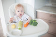 © Дмитрий Чапурин - The baby is eating vegetables.