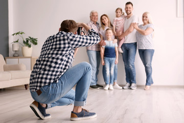 Sticker - Professional photographer taking photo of family in studio