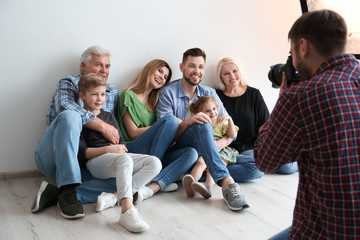 Sticker - Professional photographer taking photo of family in studio