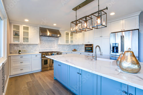 Fotografie, Obraz Beautiful white kitchen with large island.