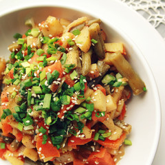 Vegetable stew with potato, carrot and green beans topped with sesame seeds. European cuisine. Healthy vegan lunch on the round white plate. European cuisine. Vegetarian. Top view. Close up.