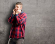 © Krakenimages.com - Young handsome man happy and surprised cheering expressing wow gesture