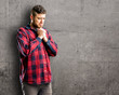 © Krakenimages.com - Young handsome man crying depressed full of sadness expressing sad emotion