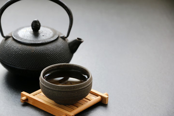 tea pot set and tea cup Japanese on black table