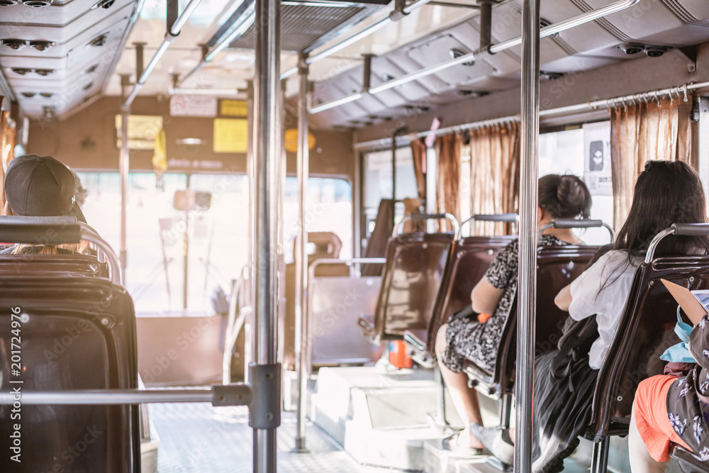 People sitting on seat in back view on the bus Stock Photo | Adobe Stock