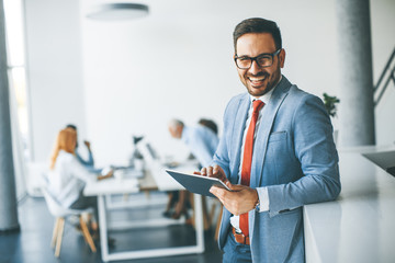 young businessman with digital tablet in office