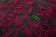 Unique Green Paperclip With Plenty Of Pink Ones