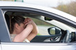 © Stephen Davies - Woman driver scared shocked before crash or accident hands off wheel