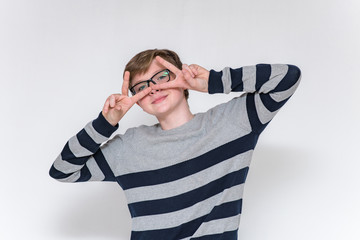 teenager in different poses on a white background showing different emotions