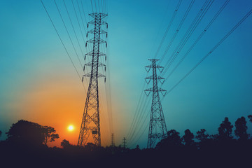 Wall Mural - high voltage poles on the orange sky concept of electric power