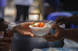 poverty concept feeding food for beggar