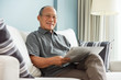 © eggeeggjiew - senior man reading newspaper.