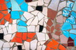Multicolor mosaic wall decorative ornament from ceramic broken tile. Barcelona, Catalonia. Background, copy space.