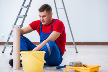 Wall Mural - Contractor worker preparing for wallpaper decoration