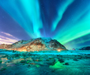 Wall Mural - aurora. northern lights in lofoten islands, norway. starry sky with polar lights. night winter lands