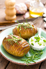 Canvas Print - Baked potato. Potato oven baked with garlic and rosemary