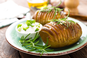 Canvas Print - Baked potato. Potato oven baked with garlic and rosemary