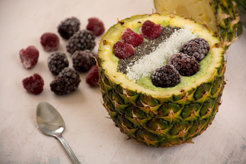 Wall Mural - Green smoothie in pineapple