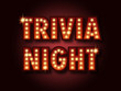 Trivia night announcement poster. Vintage styled light bulb box letters shining on dark background.Vector illustration, glowing electric sign in retro style