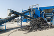 Plastic recycling facility/Plastic and rubber components resulted from cars disassembled are being shredded and separated during recycling process.