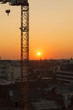 Sunset on european city with crane