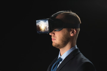 Wall Mural - 3d technology, virtual reality, cyberspace and augmented reality concept - young businessman with singapore city on virtual headset or 3d glasses screen over black background