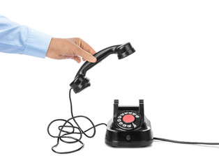 Canvas Print - Hand and vintage telephone