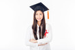 Beautiful Asian Graduated woman wearing white shirt and Graduation cap holding certificated in hand feeling so proud and happiness,Isolated on white background,Education Success Concept