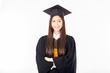 Asian graduated woman in cap and gown and cross arm feeling so proud and happiness,Isolated on white background,Education Success Concept