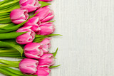 Fototapeta Tulipany - Pink tulip bouquet on light background, copy space