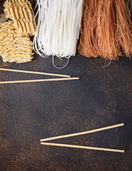 Wall Mural - Different Asian rice noodles on rusty background