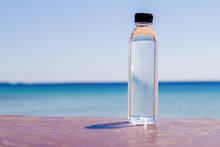 A Bottle Of Water On A Table On The Beach On A Sunny Day A Symbol Of Proper Nutrition