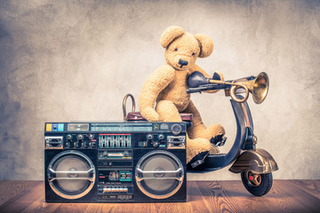 Wall Mural - retro ghetto blaster radio cassette tape recorder and teddy bear on old black toy scooter from circa