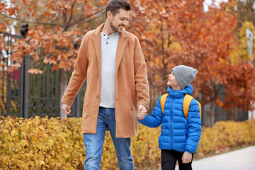 Sticker - Cute little boy going to school with his father