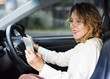 © Rawpixel.com - Woman using mobile phone while driving