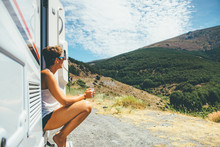 Girl Sits On A Motor Home Step