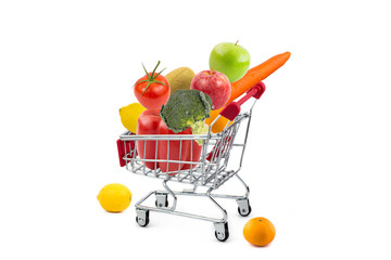 Shopping cart with fruits and vegetables on isolated white background